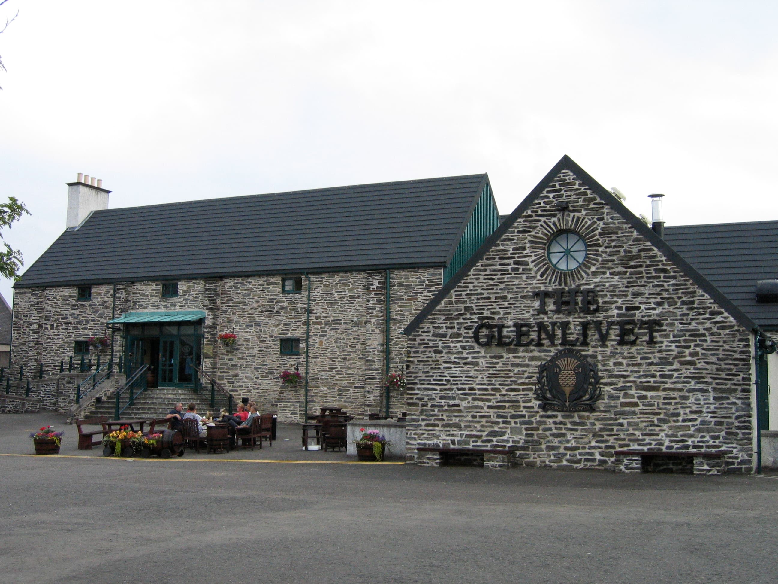 The Glenlivet distillery's stone visitor building in Speyside