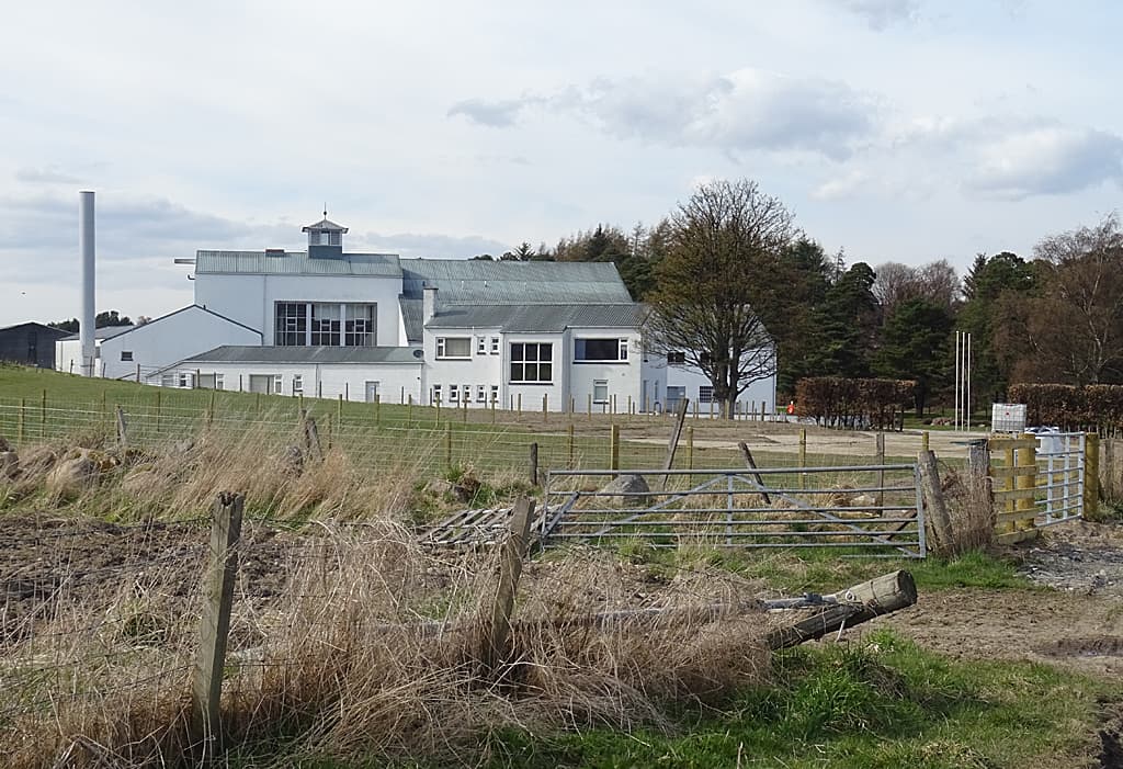 The white production buildings at GlenAllachie distillery near Aberlour