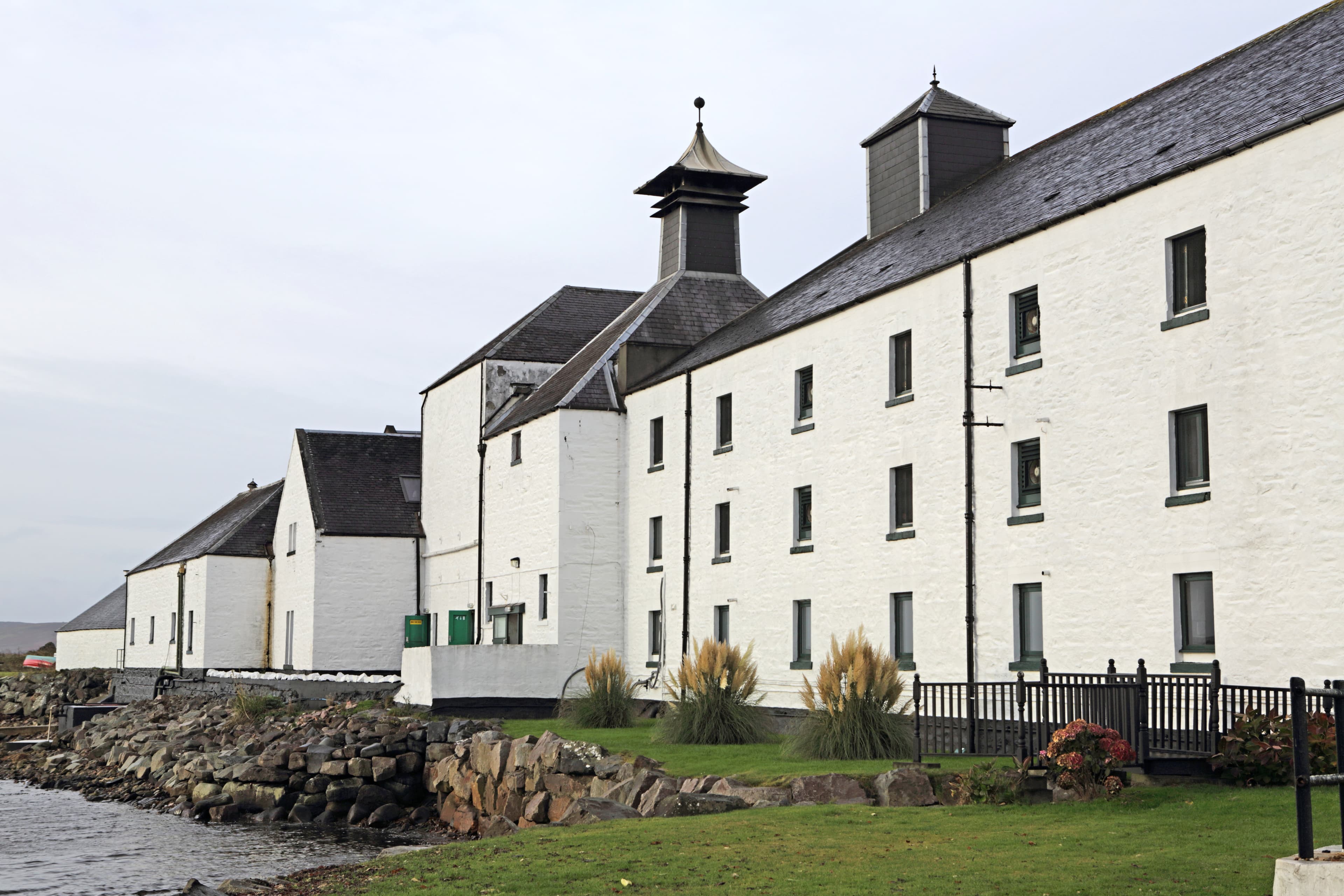 Laphroaig distillery's whitewashed buildings and pagoda kiln on Islay