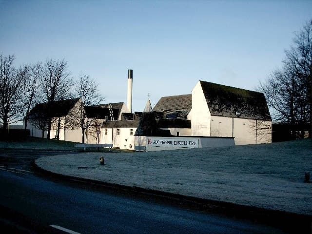 The Auchroisk distillery buildings and nameboard near Mulben