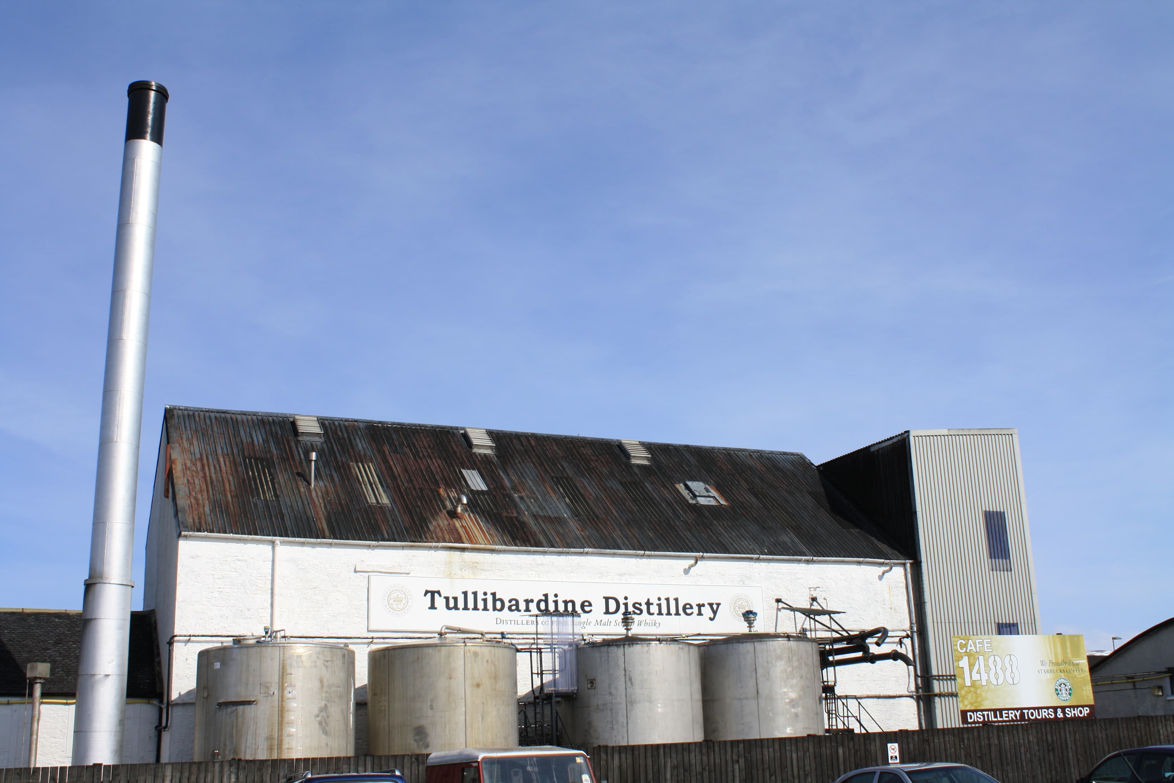 The Tullibardine distillery nameboard and stainless tanks at Blackford