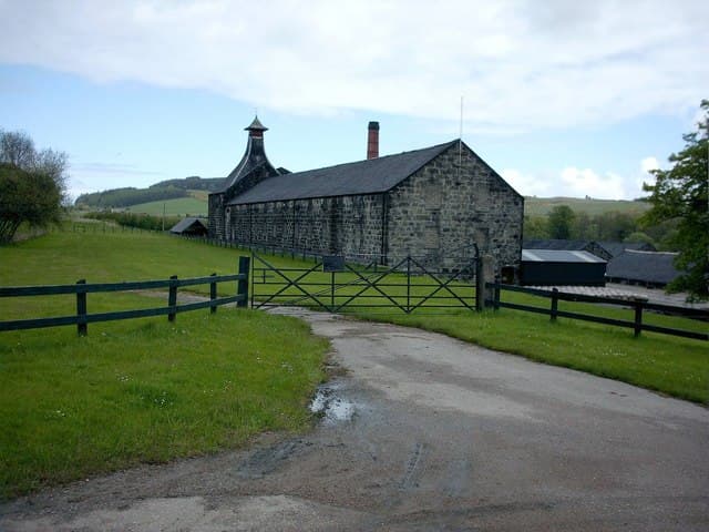 Knockdhu distillery's stone buildings and pagoda roof at Knock