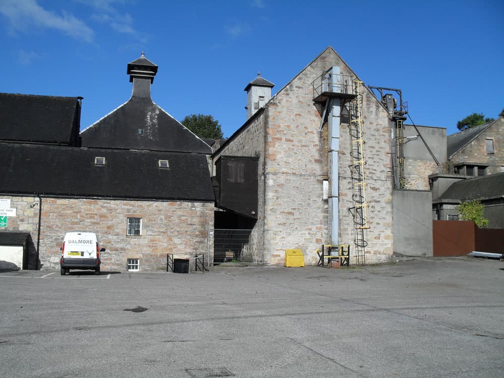 The twin pagoda roofs and stone stillhouse of Dalmore distillery at Alness