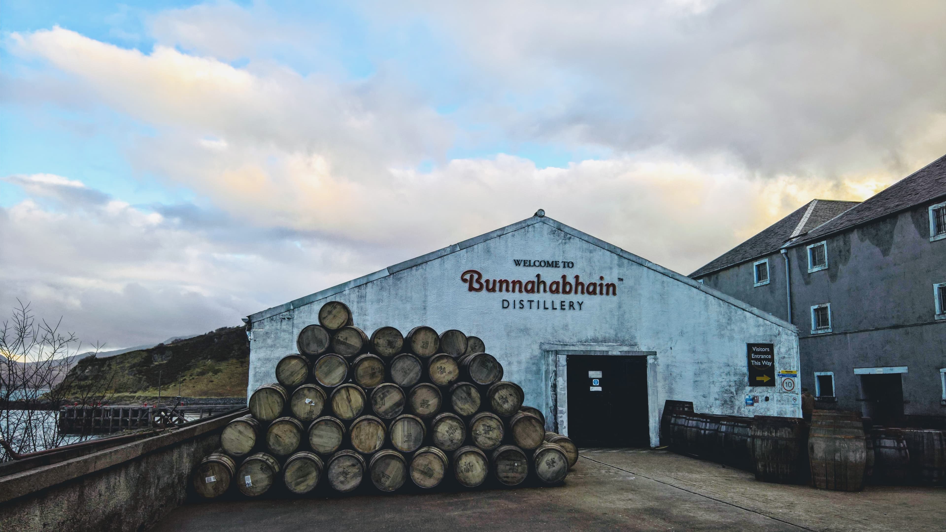 Bunnahabhain distillery's warehouse gable and stacked casks on Islay