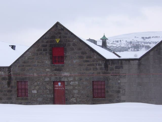 Ardmore distillery's stone maltings under snow at Kennethmont