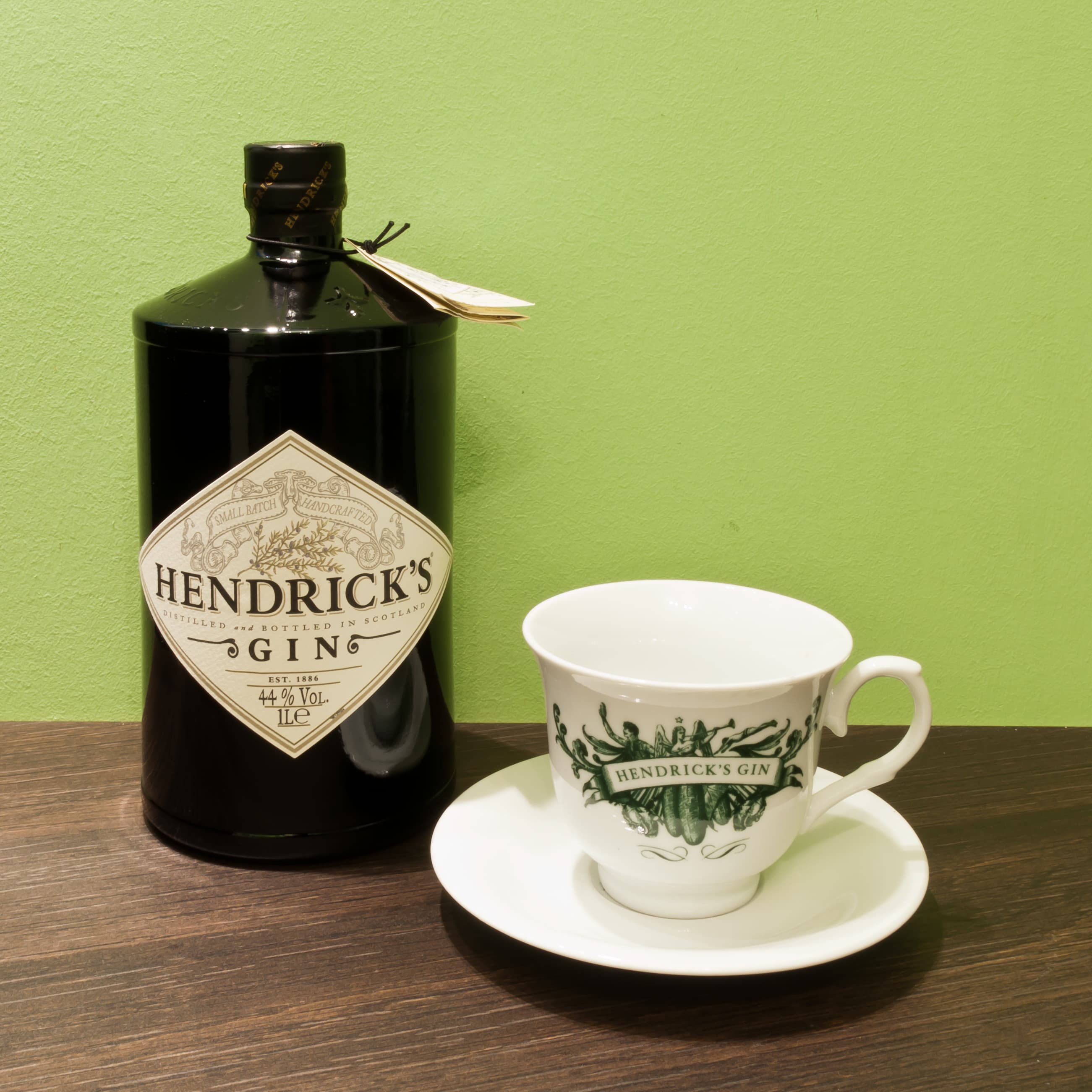 A litre bottle of Hendrick’s Gin beside a Hendrick’s teacup and saucer
