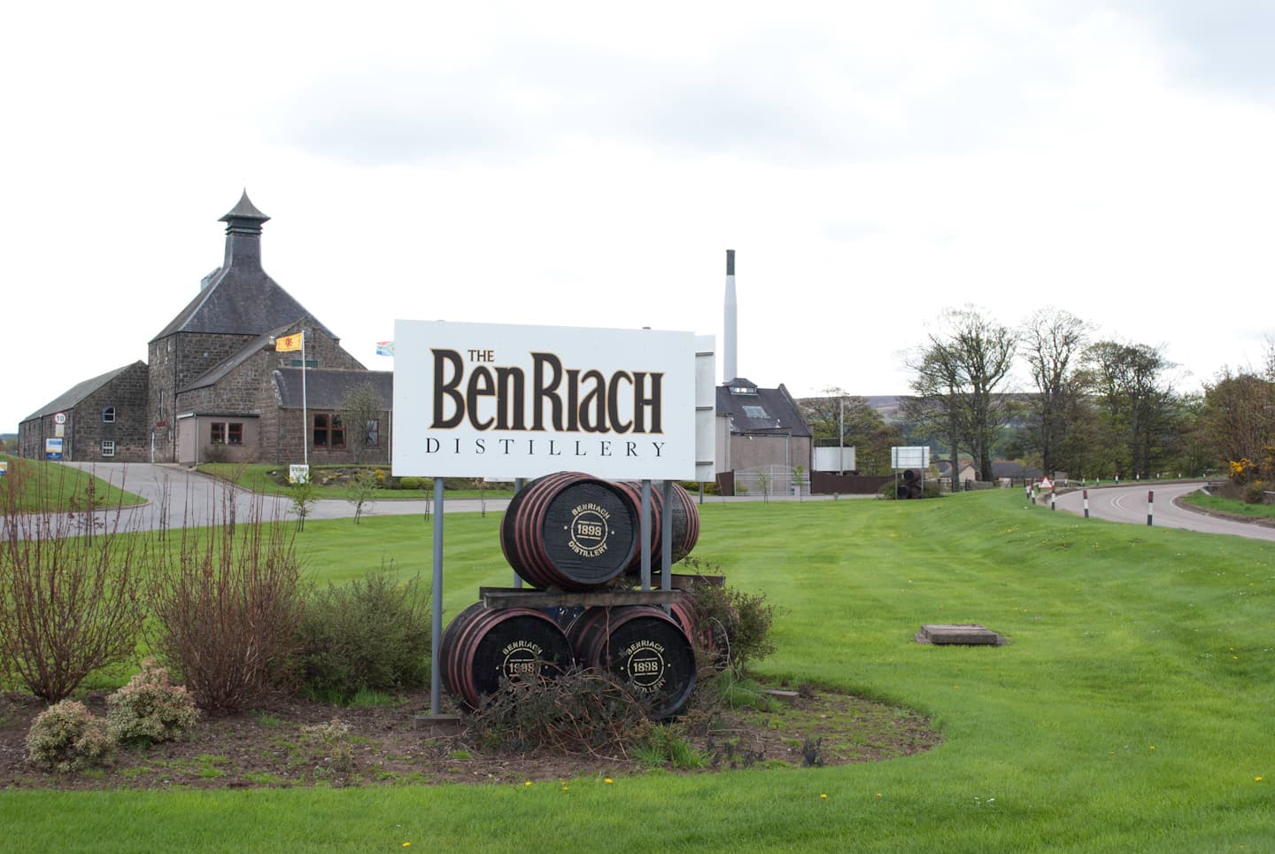 The BenRiach distillery nameboard and cask display near Elgin