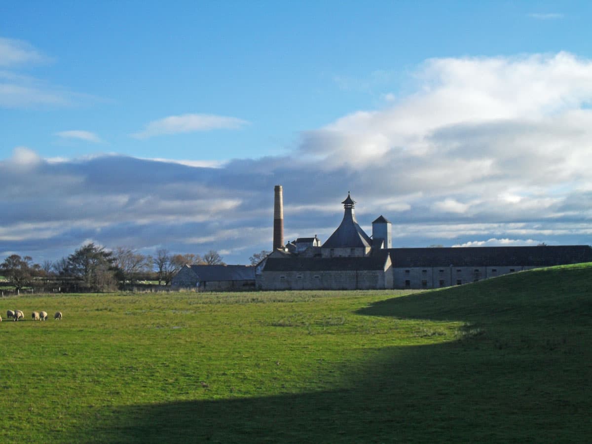 Brora distillery's pagoda roofs seen across the fields