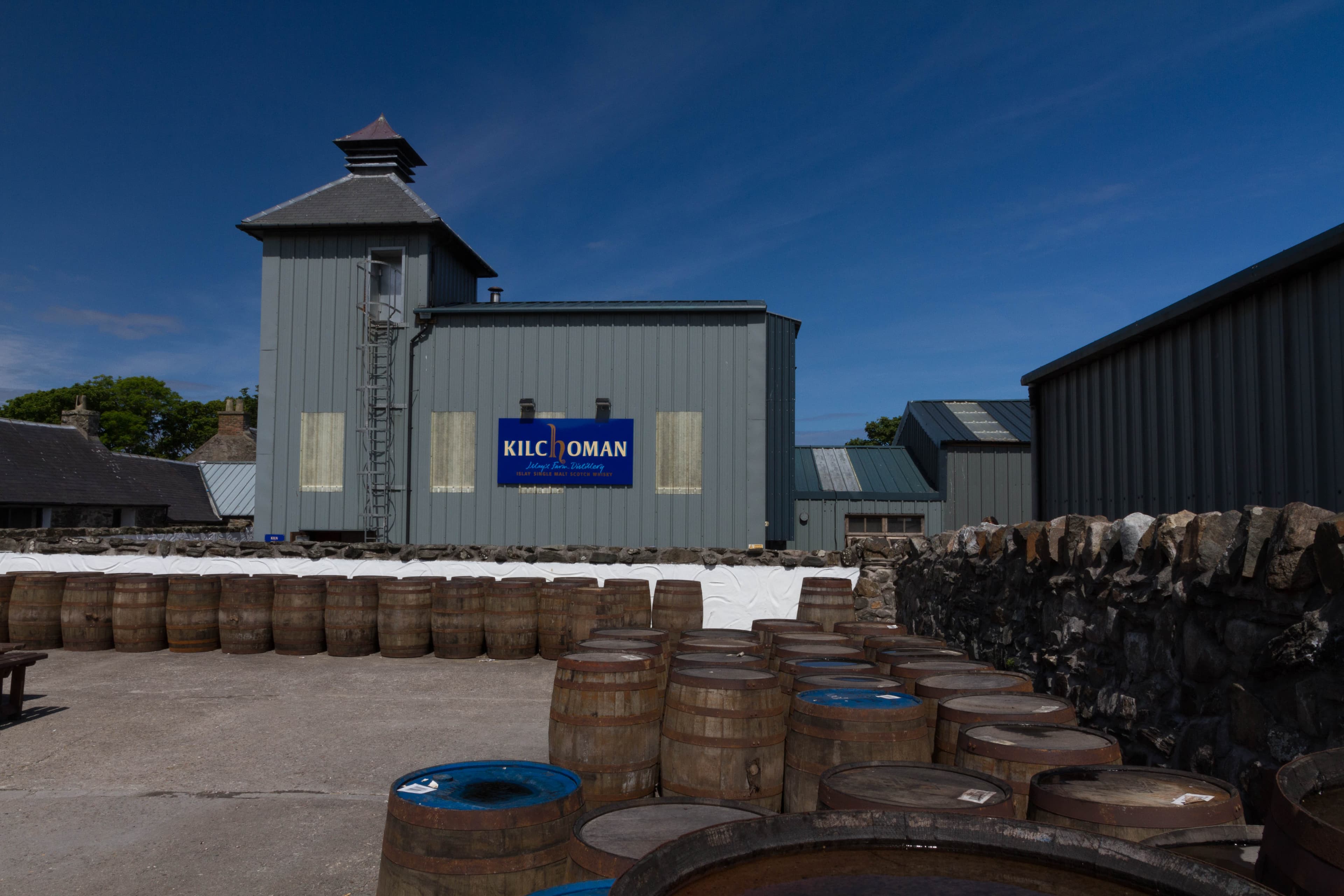 Casks stacked outside Kilchoman farm distillery on Islay