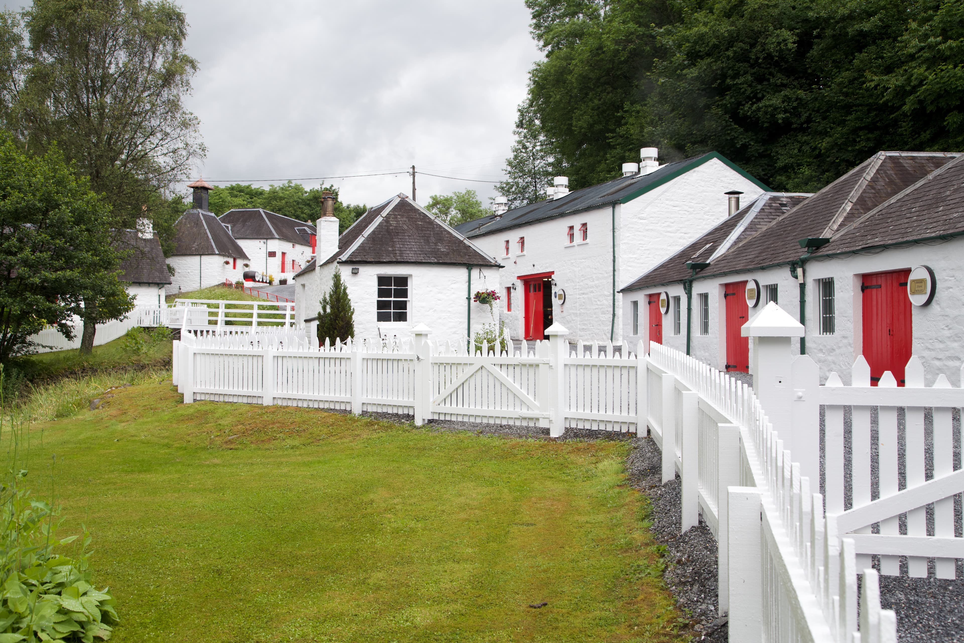 Edradour distillery's whitewashed buildings with red trim near Pitlochry