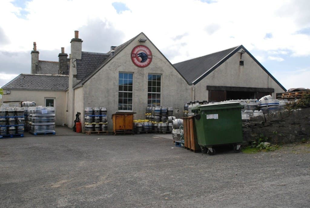 Orkney Brewery in the old Quoyloo schoolhouse, casks stacked in the yard
